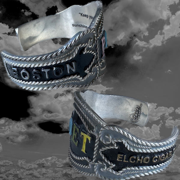 Inside this cuff, as with many of my new POP ART Collection, there is a hidden engraved quote--this one from Walt Whitman. These quotes are meant to resonate against your wrist and inspire you. I hope they do!   This one: "Keep your face in the sunshine and shadows will fall behind you."  POET Cheroot Cuff. Handmade, Hand-enameled Sterling Silver. Hand-signed. Approximately 6-1/2" Long by 2" (at center). Made in the USA! Nonbinary and designed to INSPIRE you!