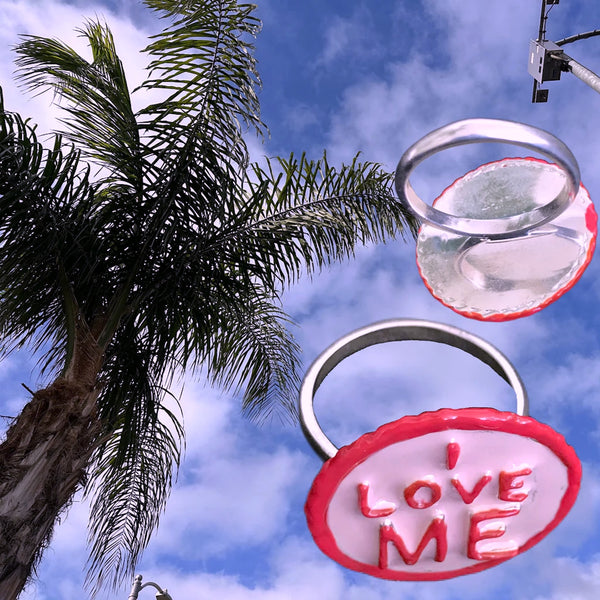 I LOVE ME Sterling Silver Gum-Ball Ring is handmade and hand-enameled and hand-signed--all right here in the good ole USA.Approximately 7/8” diameter. Come gift boxes and ready to give, or receive.  Start with yourself and feel the love radiate back. If you love yourself, you will feel too good to even care.