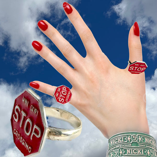 STOP in the name of love for MINISKIRTS! This whimsical tribute to the plastic 1960s Gum-Ball Rings is Handmade and Hand-Enameled Sterling Silver, and part of my new Sterling/Enamel line of fables/"stories".   Stands alone or looks FAB with any of our other fun rings!  Sterling Silver STOP SIGN approximately 1" x 1" at any angle. Red and White hand-enamel on SHINY Sterling Silver Back and Ring Shank. Sized 5-10. Email me for larger sizes. Nonbinary, as is all of my jewelry.