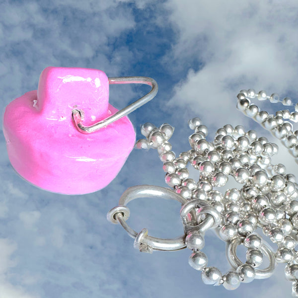 Nonbinary Sterling Silver Handmade, Hand-Enameled Barbie Pink Sink Stopper is 1" x 3/8" approximately and is hand-signed on the hollow inside. Comes with special gift wrapping--even if you are gifting yourself  For the record, Pink has ALWAYS been my favorite color. I owned a pink house, had another house with a pink kitchen and a 1965 pink T-Bird.    