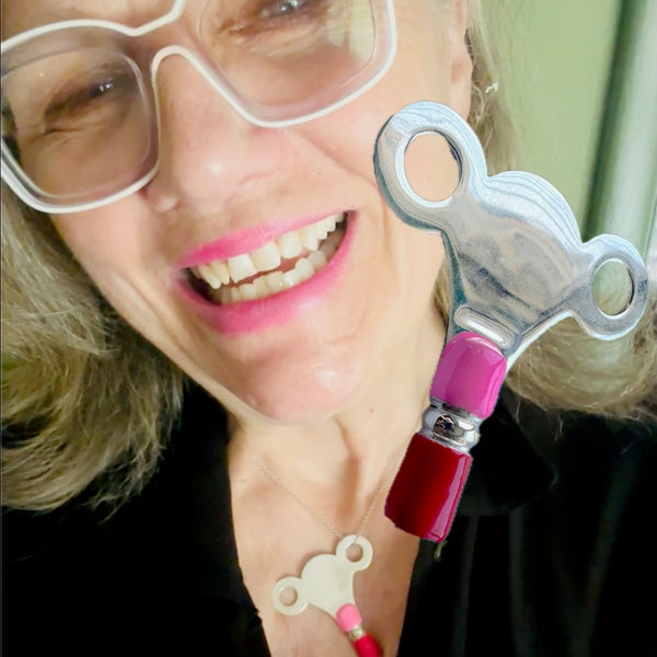 The PERSONAL AUTONOMY KEY is Sterling Silver with hand enameled Hot Pink and Red around the bottom. Approximately &nbsp; 2" x 2". Handmade, hand-enameled and hand-signed Sterling Silver Large Clock-Winding Key. If you are the keeper of the door, then this is a MUST to add to your collection of wearable KEYS! Sterling Silver PERSONAL AUTONOMY KEY Charm comes with a Sterling Silver chain like the one shown here. Comes in branded cotton pouch and gift boxed.