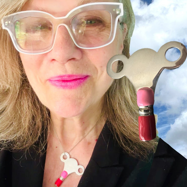 The PERSONAL AUTONOMY KEY is Sterling Silver with hand enameled Hot Pink and Red around the bottom. Approximately &nbsp; 2" x 2". Handmade, hand-enameled and hand-signed Sterling Silver Large Clock-Winding Key. If you are the keeper of the door, then this is a MUST to add to your collection of wearable KEYS! Sterling Silver PERSONAL AUTONOMY KEY Charm comes with a Sterling Silver chain like the one shown here. Comes in branded cotton pouch and gift boxed.
