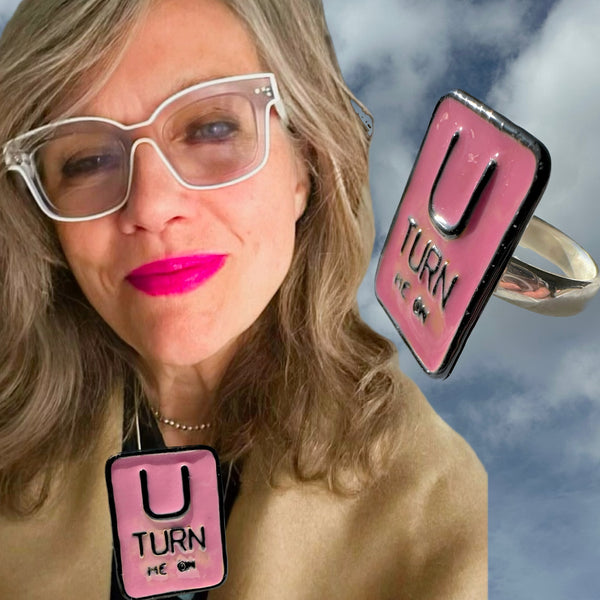 "U TURN Me On" POP ART Sterling Silverl Ring, Hand-enameled on Sterling Silver. Measures approximately 1" by 3/4". Handmade, &nbsp;Hand-Enameled and Hand-signed Here in the good ole USA! &nbsp;. Sizes 5-9 . Email me about larger sizes for an additional fee.  &nbsp;Comes in branded cotton pouch, gift-boxed &nbsp;and ready to give, or receive!  Who wouldn't want THIS Message?)