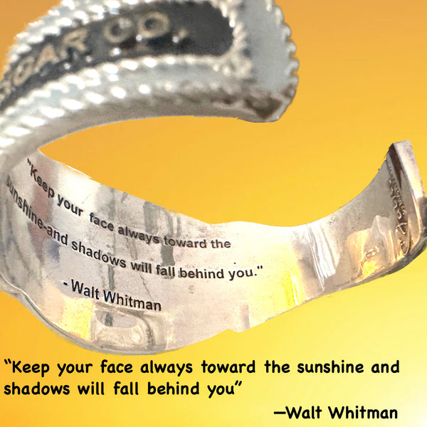 Inside this cuff, as with many of my new POP ART Collection, there is a hidden engraved quote--this one from Walt Whitman. These quotes are meant to resonate against your wrist and inspire you. I hope they do!   This one: "Keep your face in the sunshine and shadows will fall behind you."  POET Cheroot Cuff. Handmade, Hand-enameled Sterling Silver. Hand-signed. Approximately 6-1/2" Long by 2" (at center). Made in the USA! Nonbinary and designed to INSPIRE you!