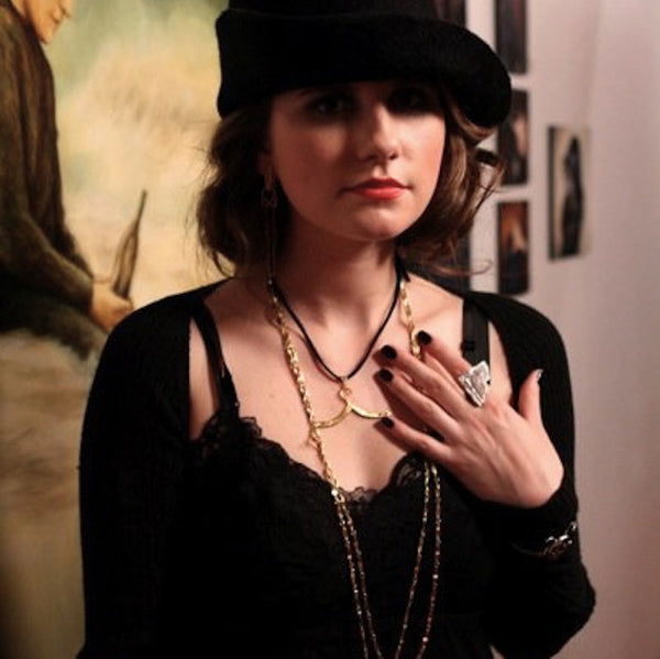 Beautiful Paris Carney in Pretty Little Hangup Hanger.Proudly announce your "hangup" with this beautiful large-scale hanger charm. (Try wearing it with the top resting in the hollow of the neck.) Available in Sterling Silver or Gold Vermeil over Sterling Silver, as shown on this hanger worn by Lisa Origliasso, of The Veronicas. This hanger charm is wonderful worn in the hollow of the collarbone, as a hanger choker necklace and is a great gift for anyone who wears clothes! (And some clothing designers!) Pret