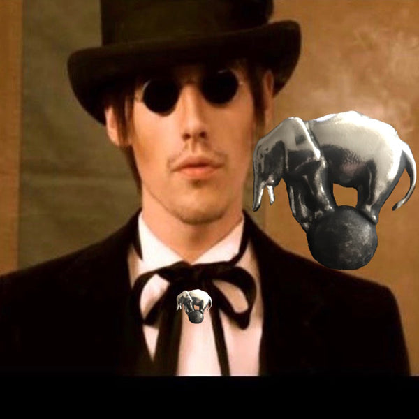 Reeve Carney in Sterling Silver Big Top Elephant on Ball Charm. Approximately 1-1/2” by 1-1/2”. Vintage Oxidized Finish. Handmade in America with love and reverence. Hand signed. Comes with special ribbon or leather cord or you can easily slip any chain of your own through the generous back loop.    A portion of the profits from the sale of this piece will go to savetheelephants.org.