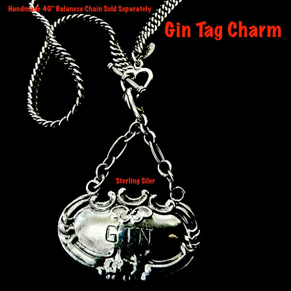 Meant to adorn a neck of a different kind, this Gin Tag adapts beautifully, and why NOT? With its beautiful 2" of on of my most favorite chains attached to the perfect bail, which opens and snaps over beads or pearls easily or slips through the most rugged chain. Engraved and ornate and available in either shiny or my vintage oxidized finish. Even teetotalers like this!  (Chains sold separately.)  1-3/4" x 1" x 2" approximately.  Sterling Silver Gin Tag  Charm. Comes with black leather cord. Made in the USA