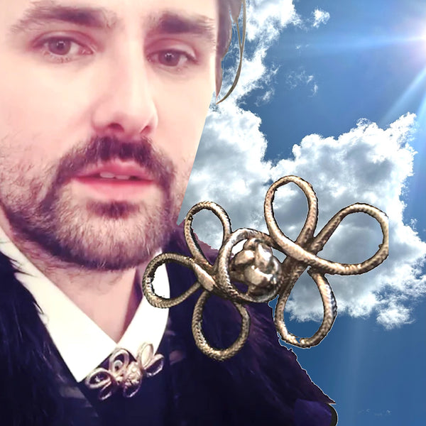 Featured in Avril Lavigne's "I Fell in Love with the Devil" video, consider this timeless piece in lieu of a tie./ From a more genteel time. Sterling Silvr "Frog" Braided Toggle Brooch. Approximately 2-3/4" x 1-5/8" Hand made in America with a story of my own. Hand-signed.  