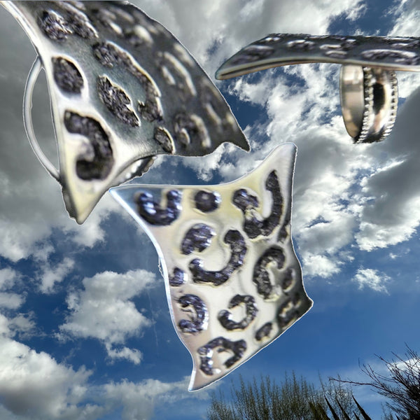 Side View of Sterling Silver Seeing Spots Leopard Ring.What can I say about this ring, except that it is PURRRfect? Shades of "Mad Men"! This ring brings back everything wonderful about the mid-60's--there is something simultaneously feminine and masculine about leopard skin. I mean, both Steven Tyler and Lady Gaga would be equally at home in fun statement piece. I'm so excited about this ring--for, as you know, my goal is to have my jewelry make you feel very special, and to create something you will want