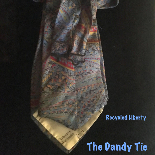 The Dandy Tie.  Each is a ONE OF A KIND and HANDMADE,by me, out of recycled neckties I handpick because of their texture or color or print. Created for men AND women, and designed to be worn for a lifetime, because of their timeless elegance, you are guaranteed to never see another like yours. Completely adjustable, the Dandy Tie is meant to be worn with or without a shirt. Use your own imagination!