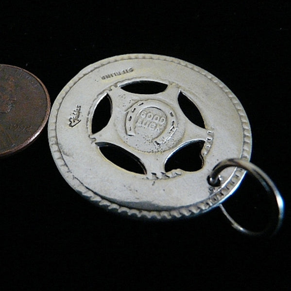 Remember those old machines at the amusement parks where you could get these in aluminum and engrave them with your boyfriend's name? Well, here's the "Sterling" version and you can take a trip down memory lane and have it engraved with a special message to someone meaningful to you. 1-1/4" diameter. Lucky Charm comes with black leather cord. Feeling LUCKY, or WANT to feel lucky? In these challenging economic times, the term "A wish and a prayer" take on more significance and I just love the optimism which 