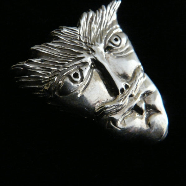 Based on some drawings actor, musician Reeve Carney made when he was 8 years old.Another wonderful piece I  designed from a drawing one of my sons when he was only 8 years old. It has that little boy "feistiness" about it!  1--5/16" x 1-1/4" Hand Made in the USA. Hand signed.  Sterling Silver Mustache Man Face-in Pendant or Pin.