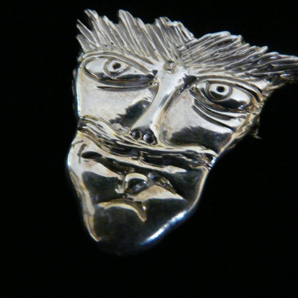 Based on some drawings actor, musician Reeve Carney made when he was 8 years old.Another wonderful piece I  designed from a drawing one of my sons when he was only 8 years old. It has that little boy "feistiness" about it!  1--5/16" x 1-1/4" Hand Made in the USA. Hand signed.  Sterling Silver Mustache Man Face-in Pendant or Pin.