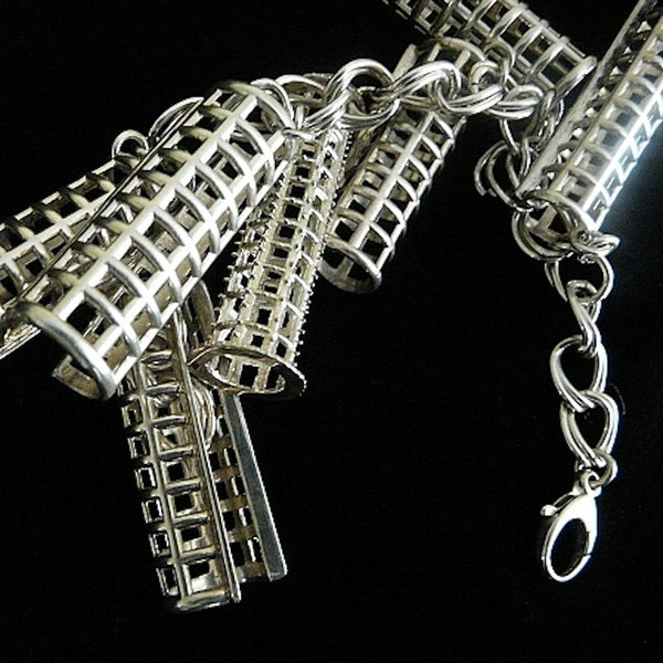 Ahhh, the price of BEAUTY past! (And one of the reasons I am known for turning items usually related to "womens' drudgery" into fashion statements--I see these things as working pieces of art in the museum of life) Simply "charming" sterling silver bracelet filled with six curler covers vying for a sole brush roller. Perfect for anyone who has hair, er... who loves and remembers brush rollers from "the day". Sterling Silver Curler and Curler Cover Charm Bracelet. Curlers-2"x5/8". Chain-7-1/2