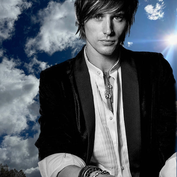 Photograph by Greg Gorman. Actor and Musician, Reeve Carney in This Fables Couture Chain Mesh Necklace uses an entire spool of radia Sterling Silver chain to give it a fabric-like mesh effect and is beautifully finished with two large open sterling silver beads, ending in playful "fringed" tassels