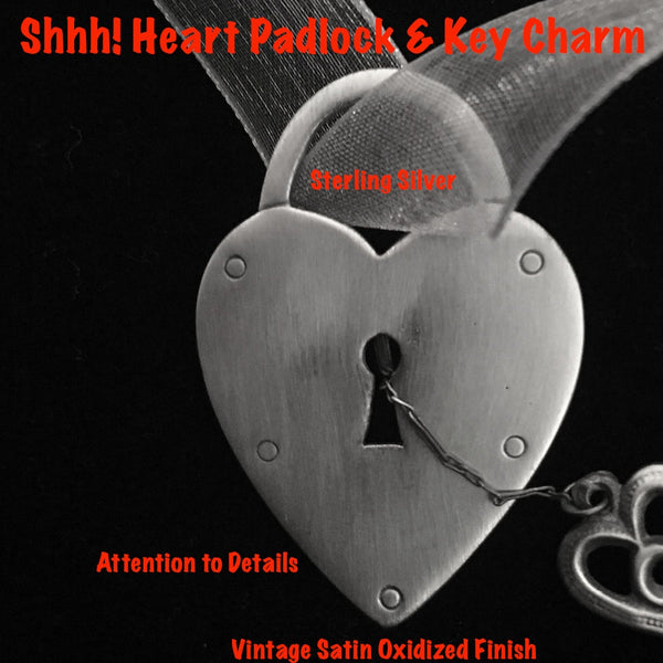 Fablesintheair.com Sterling Silver "Shhh! Heart Padlock & Key Charm. In Vintage Satin Oxidized Finish.t takes a lot of trust to dangle the key to one's heart so near the protective lock, but what fun is playing it safe in love? Sterling Silver Heart Padlock and tiny Victorian key, hanging by a beautiful strand of Sterling Silver chain. Hey, a little mystery is always good.  So is a little Mambo Italiano.