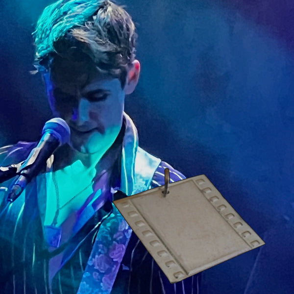 Zane Carney wearing Fablesintheair.com's Silver Screen Film Strip Charm at the December 12, 2022 Evan and Zane Show at Los Angeles Troubadour. Evan Rachel Wood ( West World) and Zane Carney (John Mayer, John Daversa Big Band, Twitch, Dave's World CBS, Jesse McCartney, Rene Olstead, CARNEY, Reeve Carney, Paris Carney, Spiderman Turn Off the Dark) Photo Credit: Lauren Pompilio.