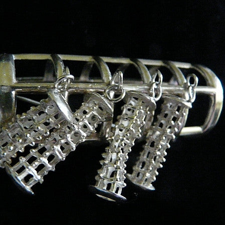Sterling Silver Curler Cover Brooch. Approximately 2-1/2" x 1". Hand made in the USA. Hand signed.