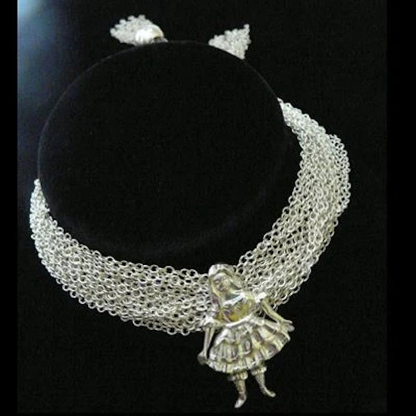  Fables Couture Chain Mesh Necklace uses an entire spool of radia Sterling Silver chain to give it a fabric-like mesh effect and is beautifully finished with two large open sterling silver beads, ending in playful "fringed" tassels  Edit alt text