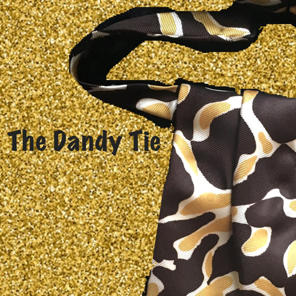 The Dandy Tie.  Each is a ONE OF A KIND and HANDMADE,by me, out of recycled neckties I handpick because of their texture or color or print. Created for men AND women, and designed to be worn for a lifetime, because of their timeless elegance, you are guaranteed to never see another like yours. Completely adjustable, the Dandy Tie is meant to be worn with or without a shirt. Use your own imagination!