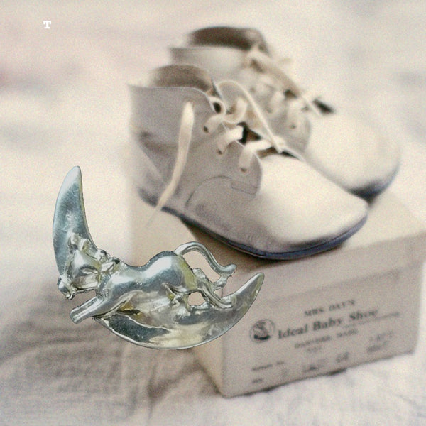 It DID and a picture's worth a thousand moos! This is the sweetest little nursery pin and don't miss the earrings of the same which is also here on my site. The spoon is totally engravable  and great to get as a gift or to treat yourself.  1" approximately. Made in the USA. Hand signed.  Sterling Silver "The Cow Jumped over the Moon" Nursery Pin. Perfect for the new Mama to wear and pass on to her baby when the time is right.
